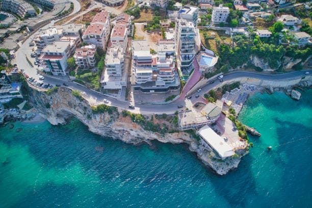 Modern apartment buildings and houses in Vlorë  showcasing beautiful real estate properties