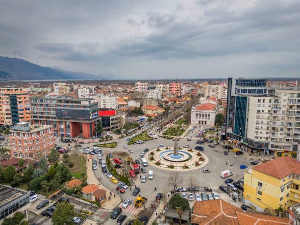 Modern apartment buildings and houses in Shkodër  showcasing beautiful real estate properties