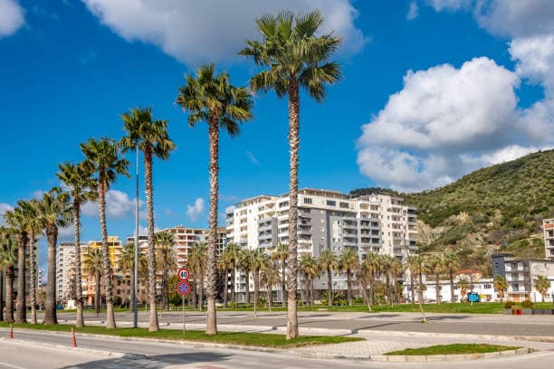 Modern apartment buildings and houses in Vlorë  showcasing beautiful real estate properties