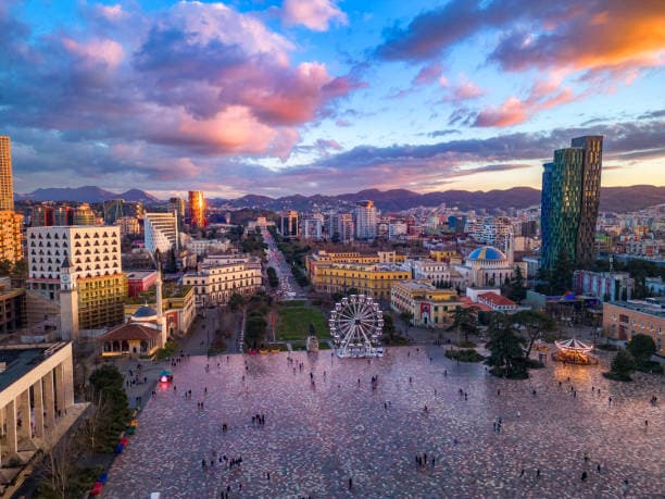 Modern apartment buildings and houses in Tirana showcasing beautiful real estate properties