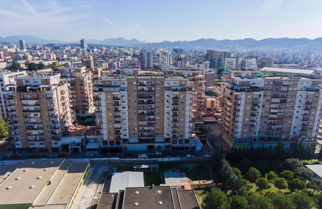 Modern apartment buildings and houses in Tirana showcasing beautiful real estate properties