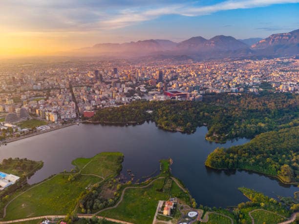 Modern apartment buildings and houses in Tirana showcasing beautiful real estate properties