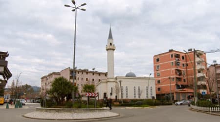 Modern apartment buildings and houses in Rrogozhinë  showcasing beautiful real estate properties