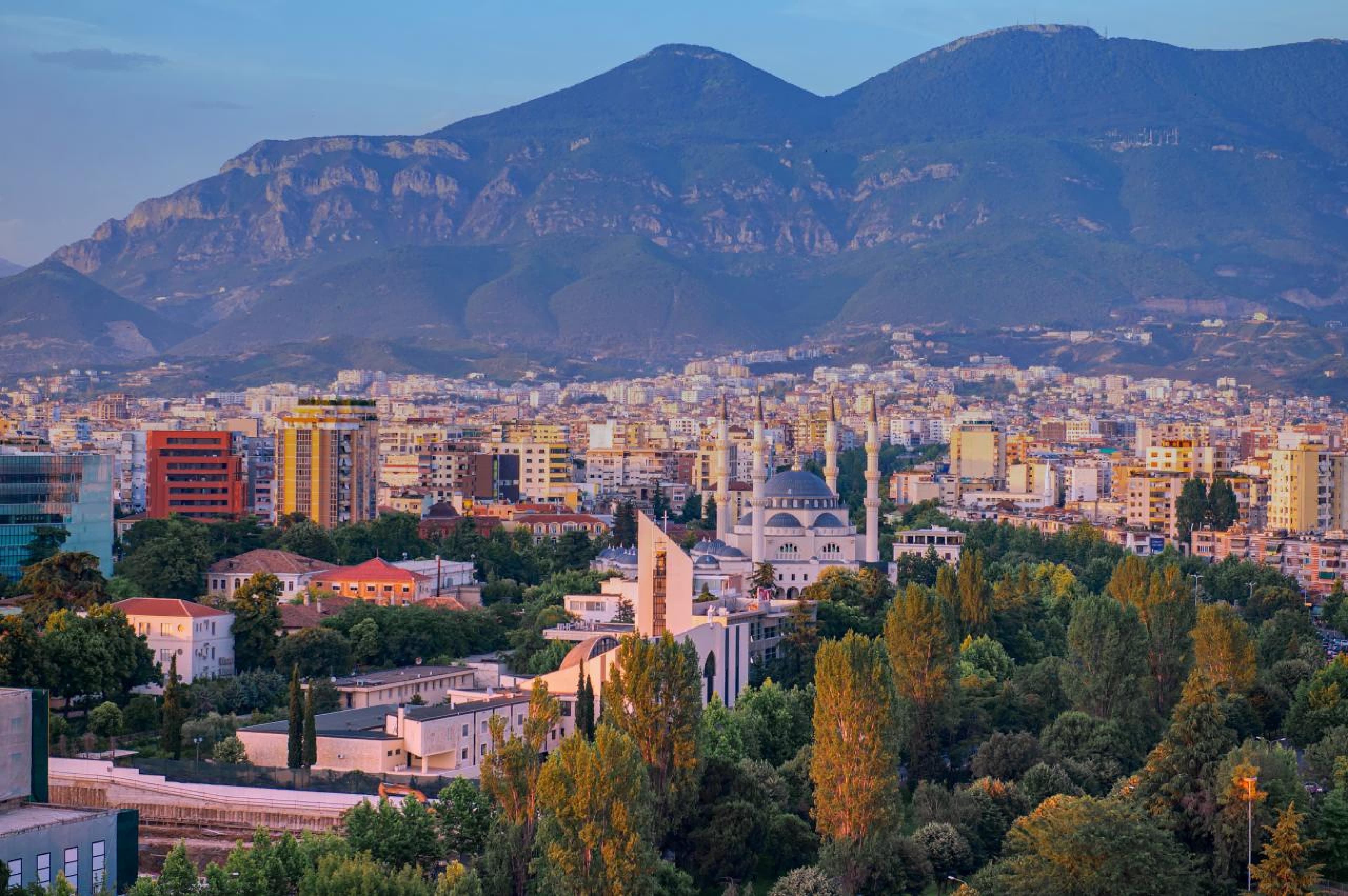 Modern apartment buildings and houses in Tirana showcasing beautiful real estate properties