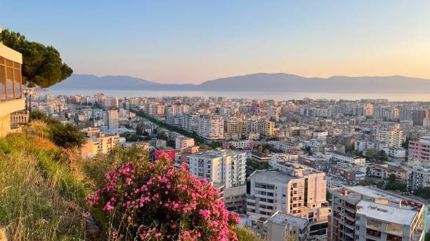 Modern apartment buildings and houses in Vlora showcasing beautiful real estate properties
