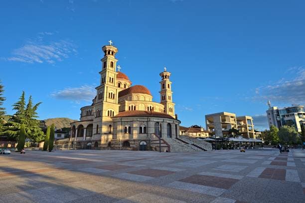 Modern apartment buildings and houses in Korçë  showcasing beautiful real estate properties