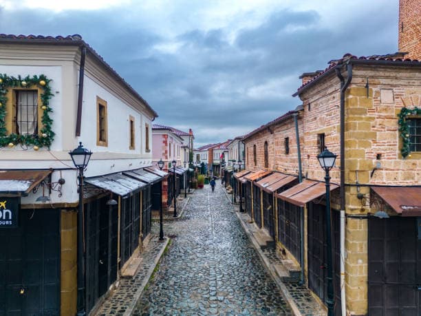 Modern apartment buildings and houses in Korce showcasing beautiful real estate properties