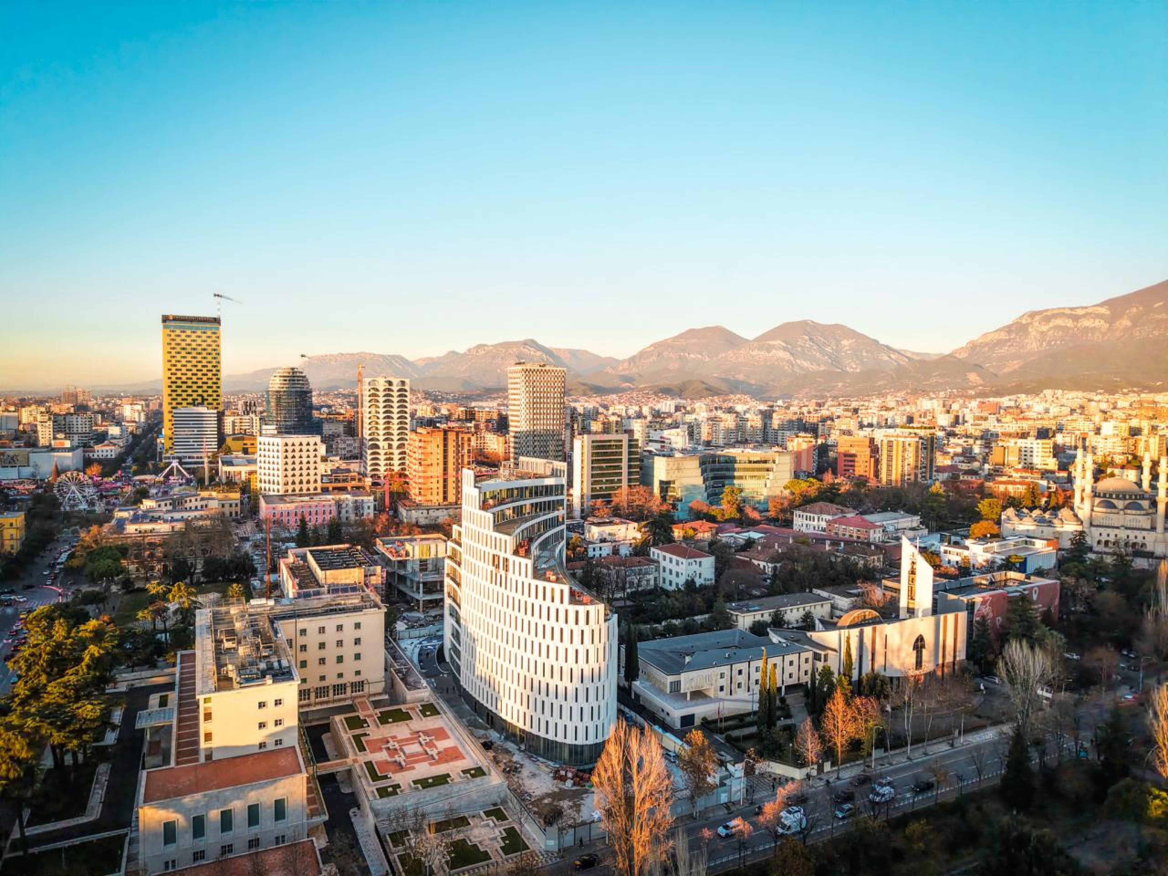 Modern apartment buildings and houses in Tirana showcasing beautiful real estate properties