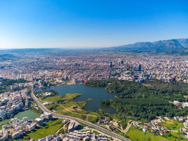Modern apartment buildings and houses in Tirana showcasing beautiful real estate properties