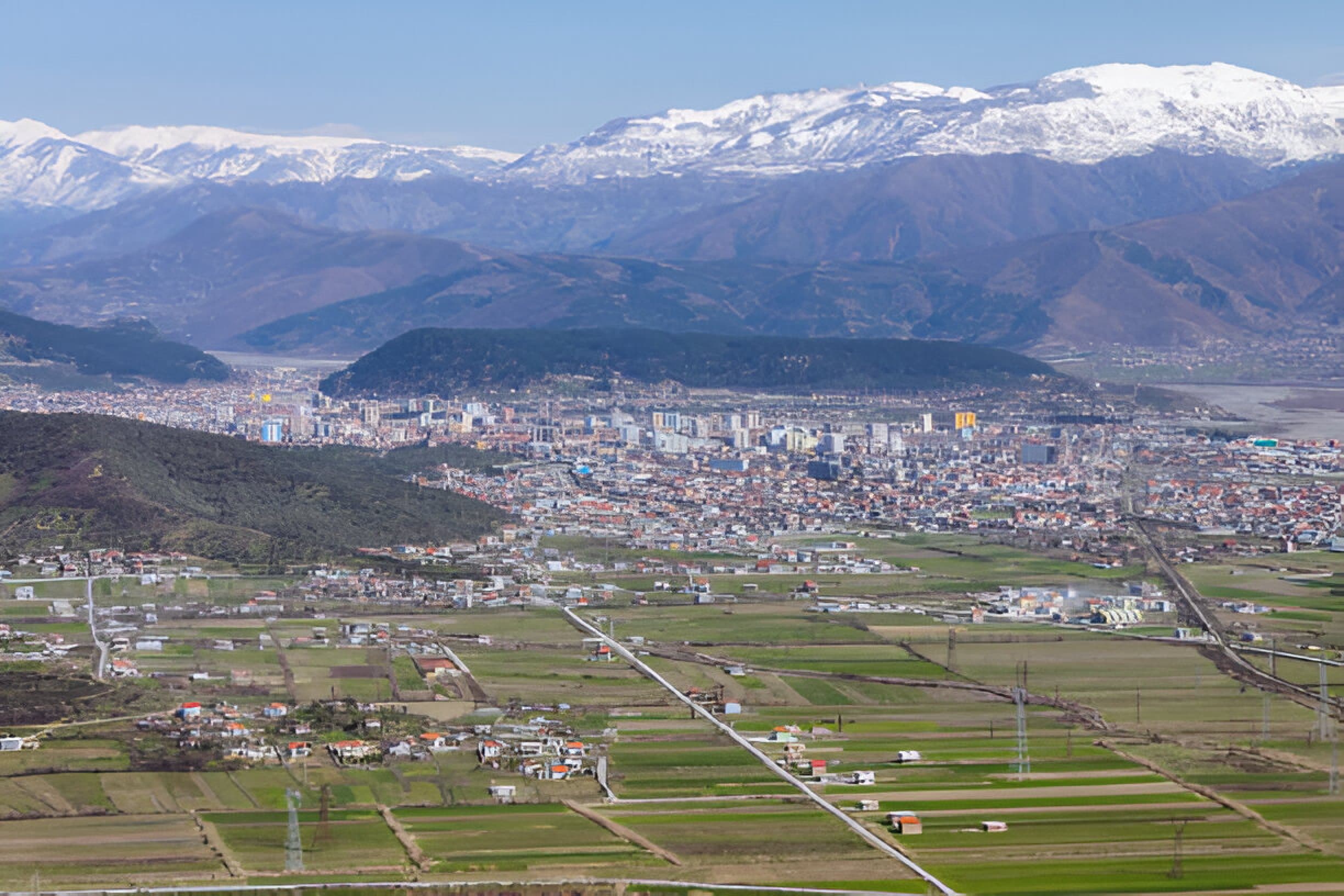Modern apartment buildings and houses in Elbasan showcasing beautiful real estate properties
