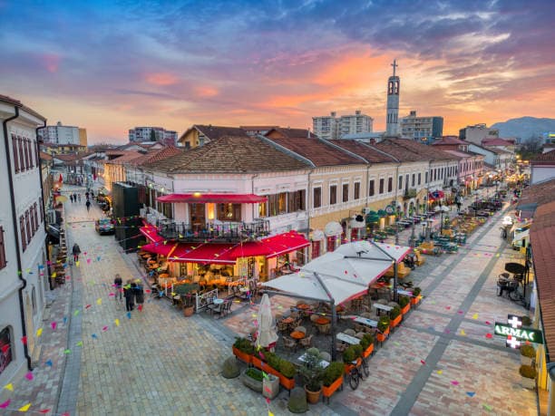 Modern apartment buildings and houses in Shkoder showcasing beautiful real estate properties
