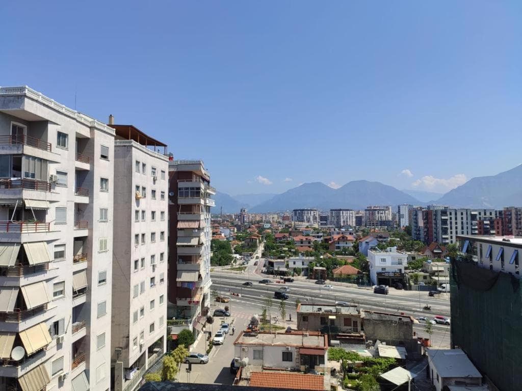 Modern apartment buildings and houses in Tirana showcasing beautiful real estate properties