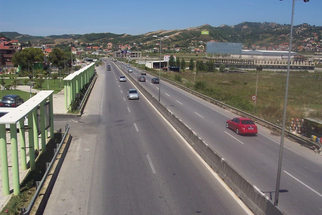 Modern apartment buildings and houses in Vorë  showcasing beautiful real estate properties