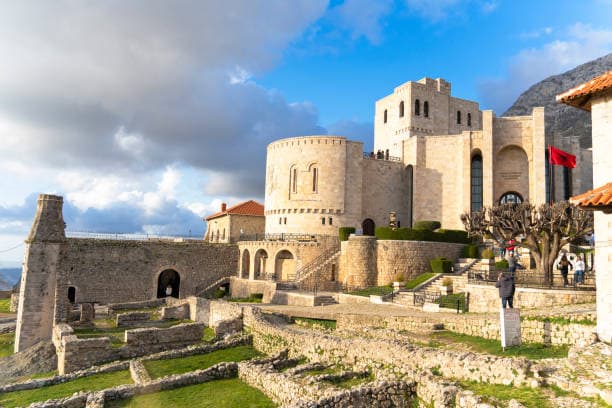 Modern apartment buildings and houses in Krujë  showcasing beautiful real estate properties