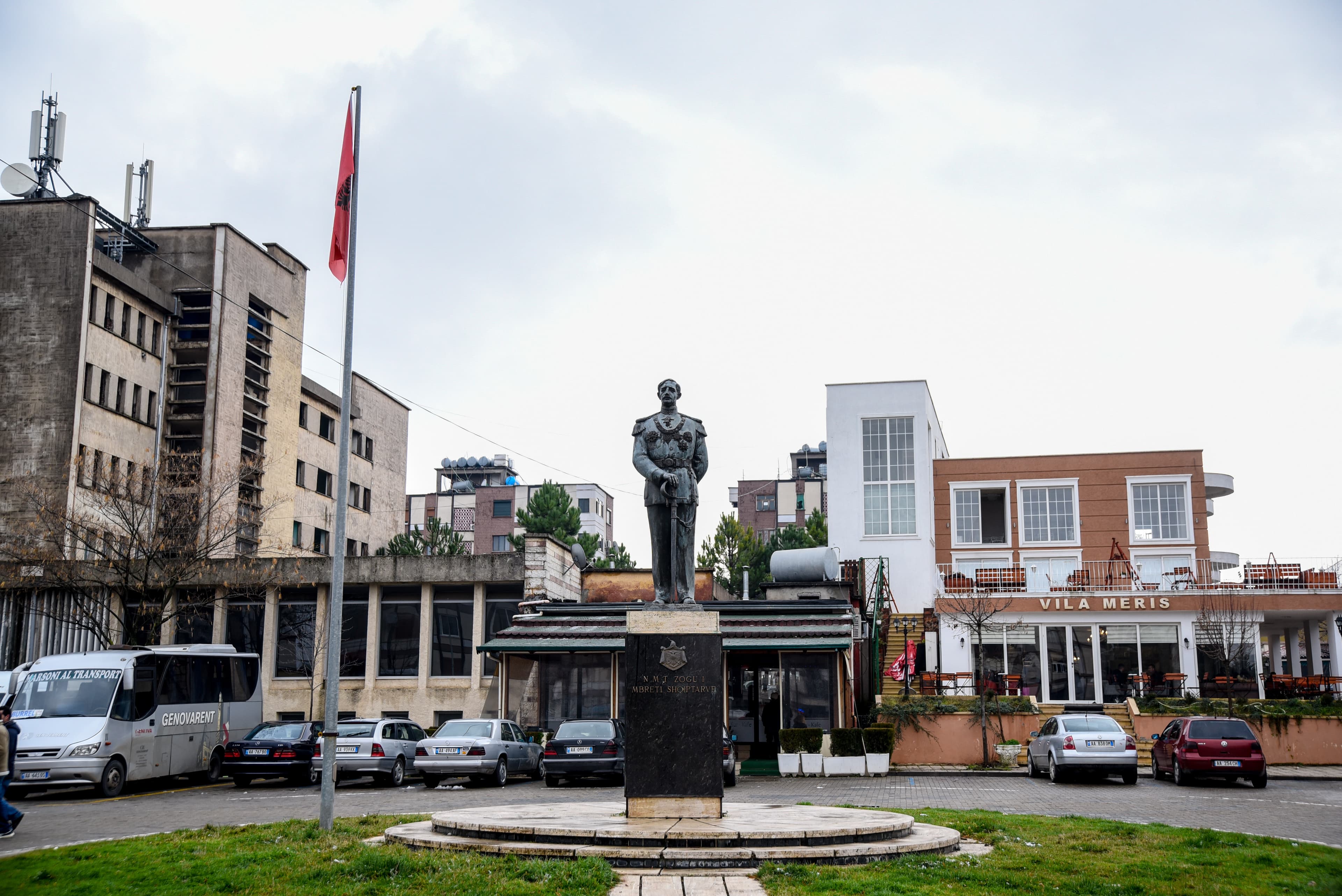Modern apartment buildings and houses in Burrel showcasing beautiful real estate properties