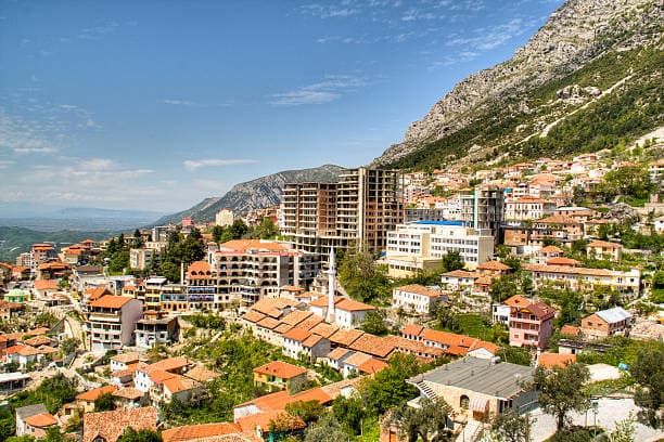 Modern apartment buildings and houses in Tirana showcasing beautiful real estate properties