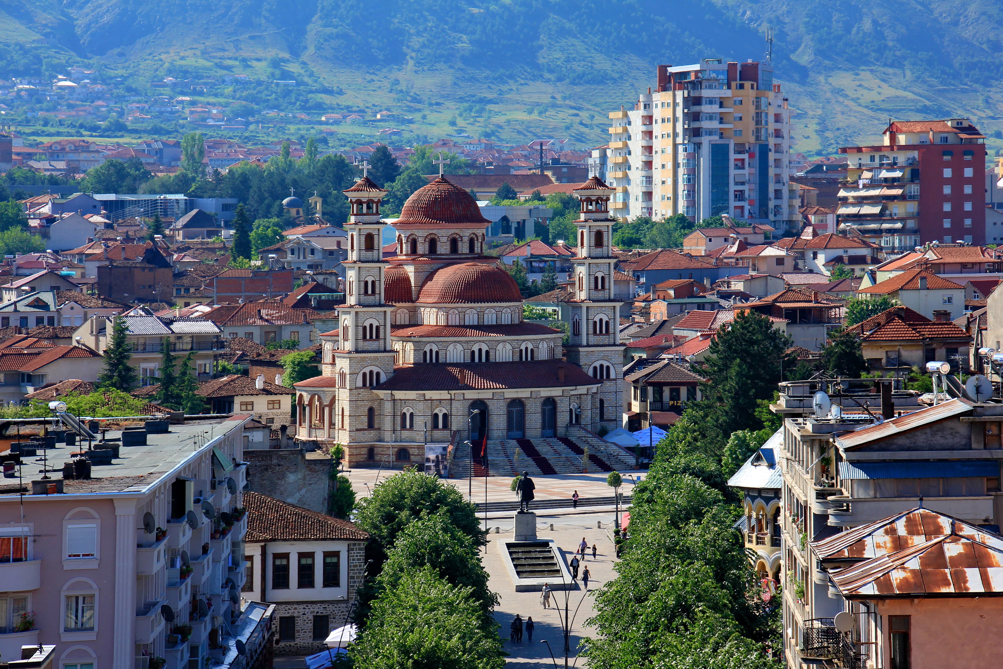 Modern apartment buildings and houses in Korçë  showcasing beautiful real estate properties