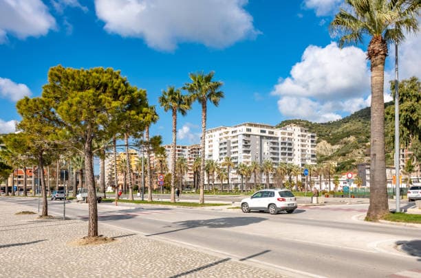 Modern apartment buildings and houses in Vlorë  showcasing beautiful real estate properties