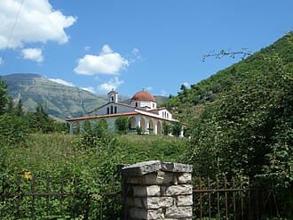 Modern apartment buildings and houses in Delvinë showcasing beautiful real estate properties