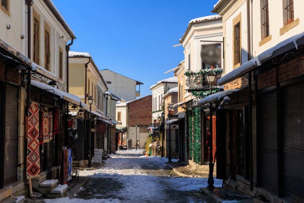 Modern apartment buildings and houses in Korçë  showcasing beautiful real estate properties