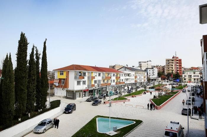 Modern apartment buildings and houses in Shijak  showcasing beautiful real estate properties