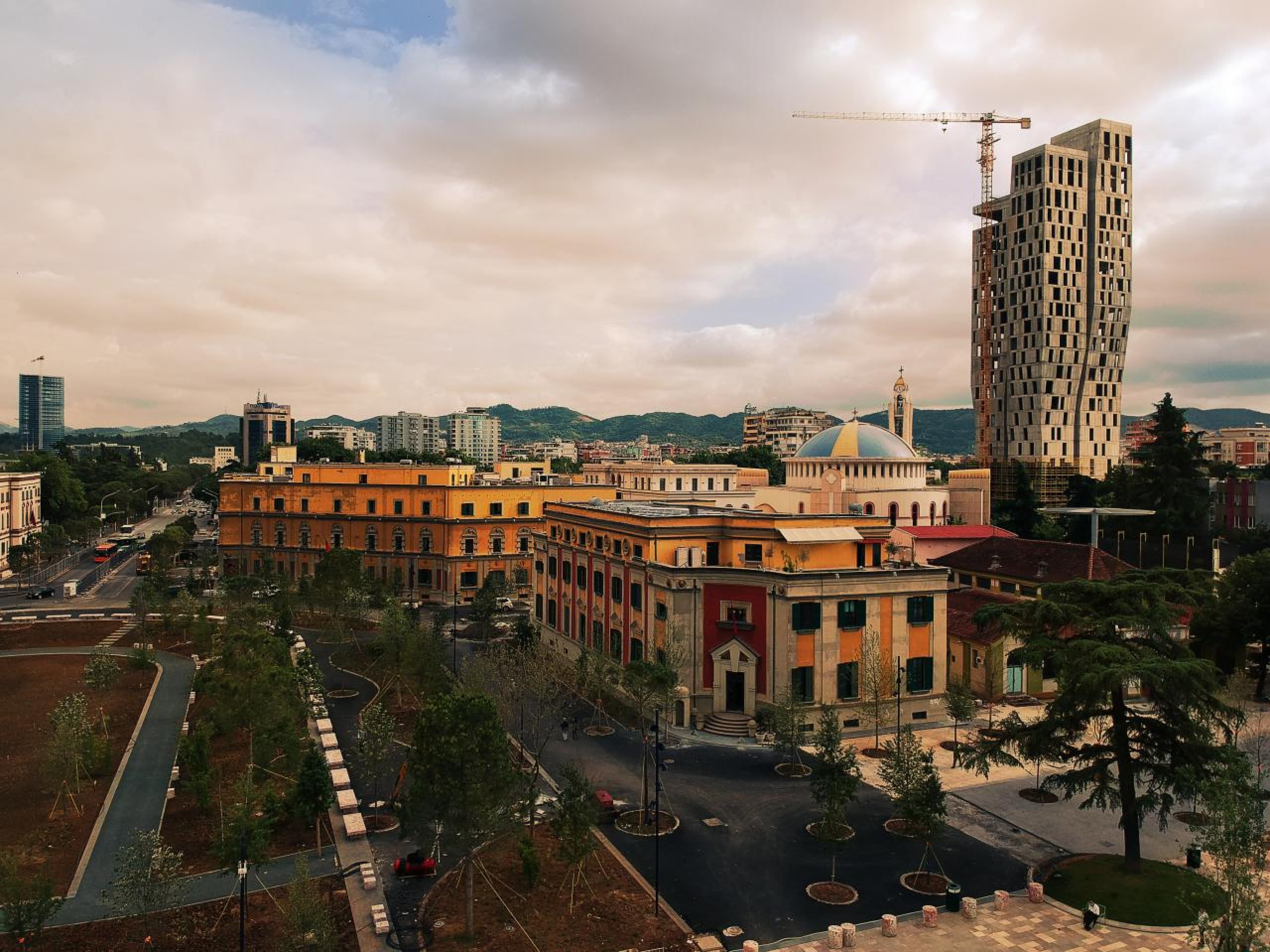 Modern apartment buildings and houses in Tirana showcasing beautiful real estate properties