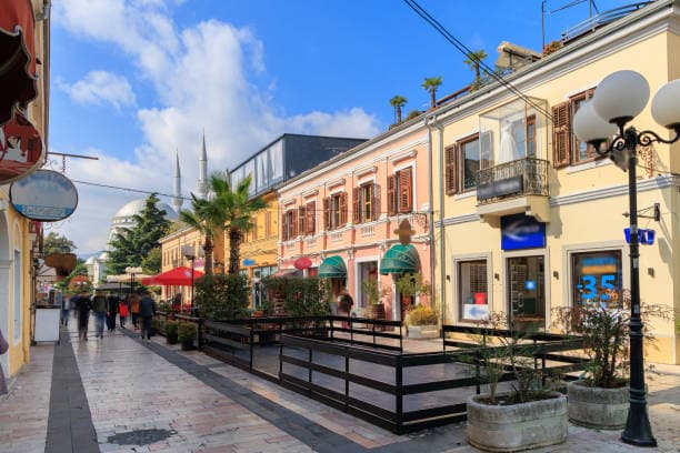 Modern apartment buildings and houses in Shkodër  showcasing beautiful real estate properties